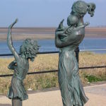 Bronze Statue of Family Waving Goodbye